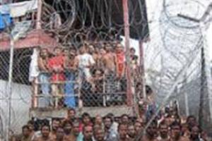La foto es de migrantes detenidos en Malasia, de Amnistía Internacional
